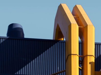 a blue and yellow building with a blue sky in the background