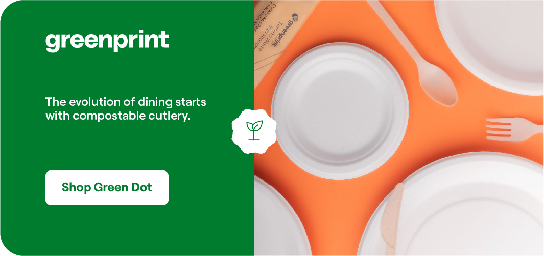 Greenprint compostable plates and an orange fork on a white surface, showcasing the evolution of dining with plant-based tableware