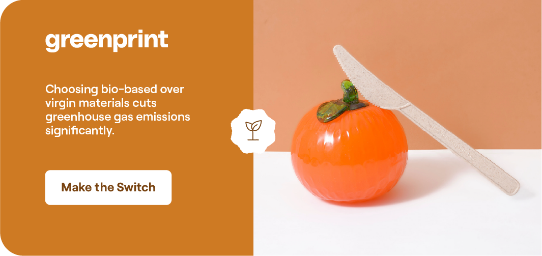Compostable cutlery with fresh produce showing how bio-based materials reduce greenhouse gas emissions compared to virgin plastics