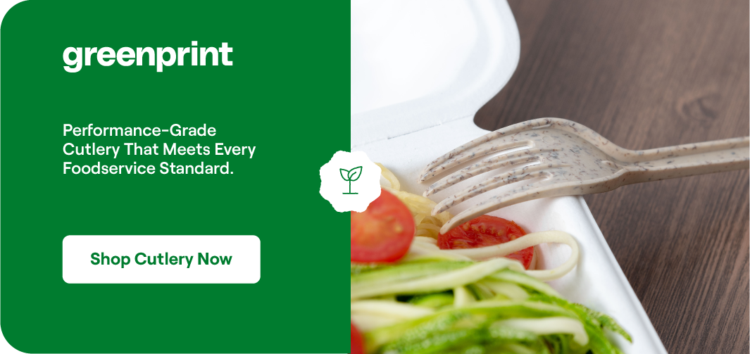 Greenprint compostable fork cutting through fresh vegetables on a white plate